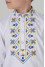 Embroidered shirt for a boy "Flowers of Life" in white with yellow and blue ornament