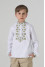 Embroidered shirt for a boy "Flowers of Life" in white with olive ornament