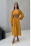 "Cordova" mustard-colored dress with print