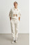 Брючний костюм «Баранці» молочного кольору