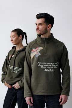 Pair of khaki Bird of Power sweatshirts